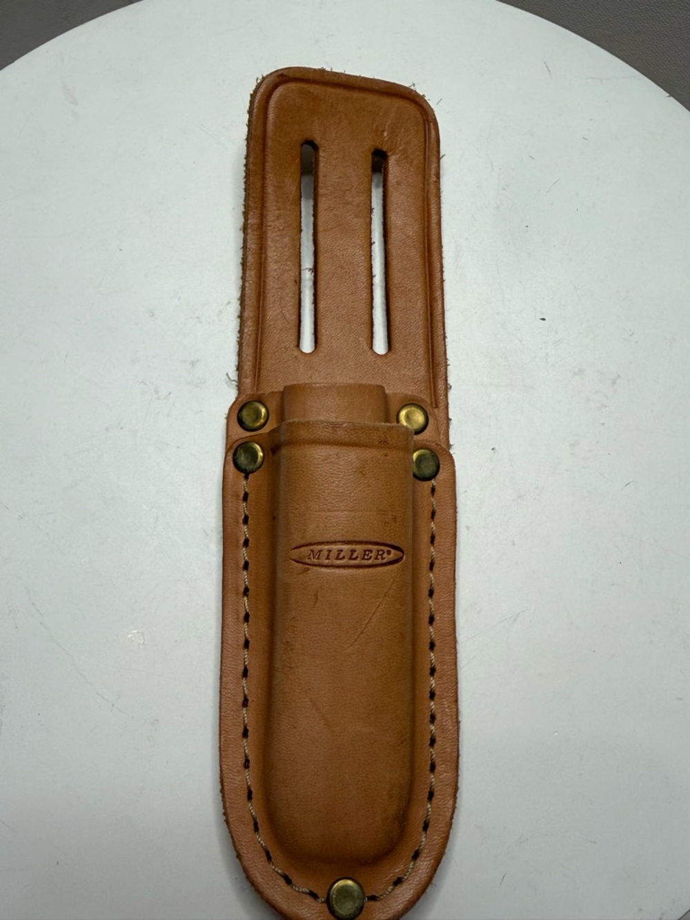 A leather case (holster) for tools